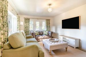 a living room with a couch and a tv at 3 Bed in Calver oc-h33087 in Curbar