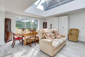 a living room with a couch and a table at 4 Bed in Harmans Cross oc-wy278 in Corfe Castle