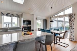 a kitchen and dining room with a table and chairs at 3 Bed in Burnham Market oc-2334 in Burnham Market