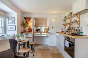 a kitchen with a table and a dining room at 2 Bed in St. Ives oc-p00568 in St Ives