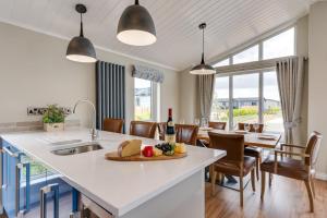 a kitchen and dining room with a table and chairs at 3 Bed in Burnham Market oc-2333 in Burnham Market
