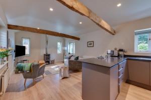 a kitchen with a counter and a living room at 1 Bed in Middleton oc-stbc in Middleton