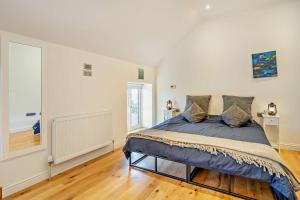 a bedroom with a large bed in a room at 3 Bed in Defynnog oc-p33133 in Devynock