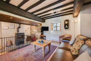 a living room with a couch and a table at 3 Bed in Dolgellau oc-wah569 in Llanfachreth