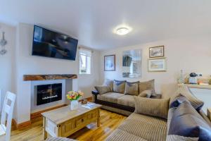 a living room with a couch and a fireplace at 2 Bed in Dunnington oc-s34137 in Dunnington