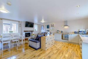 a living room with a kitchen and a dining room at 2 Bed in Dunnington oc-s34137 in Dunnington