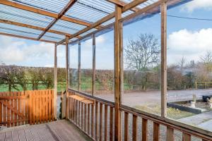 a screened porch with a view of a field at 2 Bed in Dunnington oc-s34137 in Dunnington
