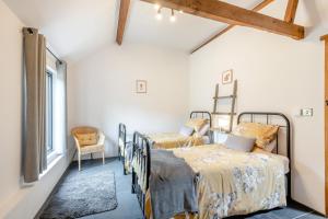 a bedroom with two beds and a window at 3 Bed in Wood Dalling oc-caba in Wood Dalling