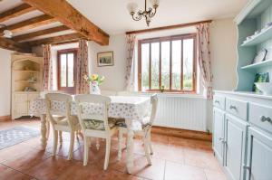 a dining room with a table and chairs at 2 Bed in Erpingham oc-2278 in Erpingham +2 photos