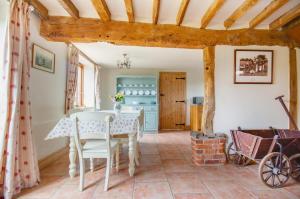 a dining room with a white table and chairs at 2 Bed in Erpingham oc-2278 in Erpingham