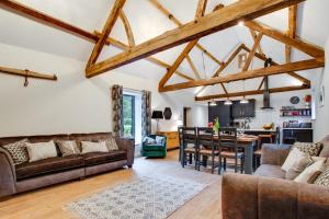 a living room with a couch and a dining room at 4 Bed in Dinas Mawddwy oc-bow305 in Aber Cowarch +30 photos