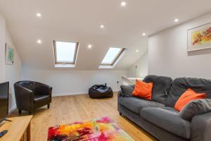 a living room with a couch and a chair at 2 Bed in Mumbles oc-hh382 in The Mumbles