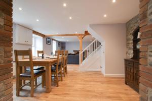 a kitchen and dining room with a table and chairs at 2 Bed in Tregaron oc-bow289 in Tregaron