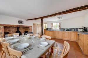 a kitchen and dining room with a table and chairs at 4 Bed in Saxmundham oc-oth in Dunwich
