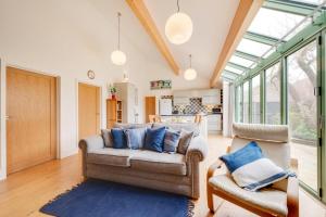 a living room with a couch and a chair at 2 Bed in Holt oc-2274 in Holt