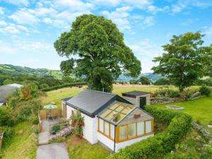 an overhead view of a tiny house in a field at 1 Bed in Llanrwst oc-wag696 in Llanrwst