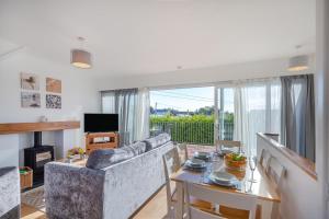 a living room with a couch and a table at 2 Bed in Abersoch oc-23caed in Abersoch