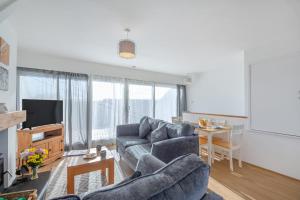a living room with a couch and a table at 2 Bed in Abersoch oc-23caed in Abersoch
