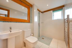 a bathroom with a toilet and a sink and a mirror at 2 Bed in Beckley oc-rh1116 in Beckley +12 photos