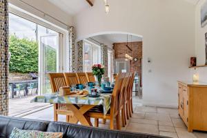 a dining room with a table and chairs at 4 Bed in Slindon oc-t29883 in Eccleshall