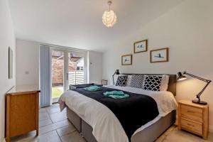 a bedroom with a large bed and a window at 4 Bed in Slindon oc-t29883 in Eccleshall