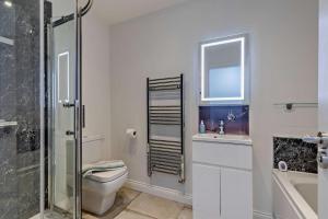 a bathroom with a toilet and a sink and a shower at 4 Bed in Slindon oc-t29883 in Eccleshall +16 photos