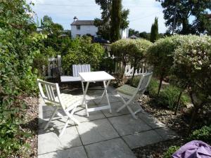 a white table and two chairs on a patio at 2 Bed in Reydon oc-aatheh in Reydon