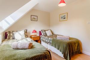 a bedroom with two beds in a attic at 2 Bed in Woodbridge oc-vav in Hollesley
