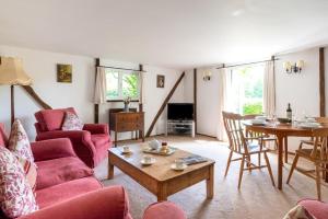 a living room with a couch and a table at 2 Bed in Biddenden oc-cb559 in Biddenden