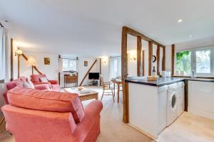 a kitchen and living room with a couch and a table at 2 Bed in Biddenden oc-cb559 in Biddenden