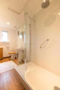 a bathroom with a tub and a shower and a sink at 2 Bed in Biddenden oc-cb559 in Biddenden +11 photos