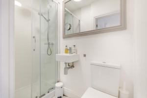 a bathroom with a shower and a sink and a mirror at 4 Bed in Cley oc-m33116 in Cley next the Sea +19 photos