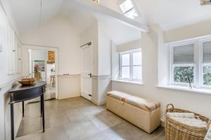 a living room with a table and a couch at 4 Bed in Cley oc-m33116 in Cley next the Sea
