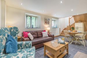 a living room with a couch and a table at 1 Bed in Bodmin oc-p00438 in Bodmin
