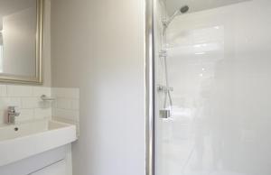a bathroom with a shower and a sink at 4 Bed in Walberswick oc-ltm in Walberswick +13 photos