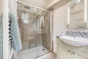 a bathroom with a shower and a sink at 1 Bed in Bodmin oc-p00438 in Bodmin +14 photos
