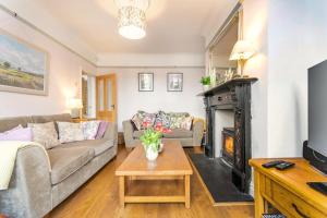 a living room with a couch and a fireplace at 3 Bed in Crich oc-dcivyd in Crich