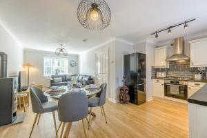 a kitchen and living room with a table and chairs at 2 Bed in Alnwick oc-e33447 in Embleton