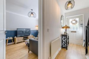 a living room with a couch and a television at 2 Bed in Alnwick oc-e33447 in Embleton