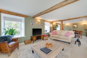 a living room with a couch and a table at 4 Bed in Brithdir oc-wag722 in Cross Foxes