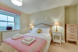 a bedroom with a bed with two towels on it at 4 Bed in Brithdir oc-wag722 in Cross Foxes