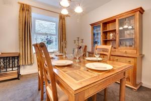 a dining room with a wooden table and chairs at 3 Bed in Hawes oc-ds1009 in Hawes
