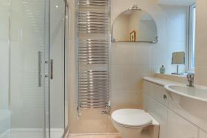 a bathroom with a shower and a toilet and a sink at 3 Bed in Hawes oc-ds1009 in Hawes