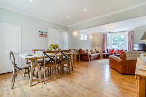 a kitchen and living room with a table and chairs at 4 Bed in Southwold oc-l29092 in Southwold