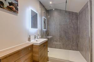 a bathroom with a sink and a glass shower at 10 Bed in Barsham oc-rrest in Beccles +31 photos