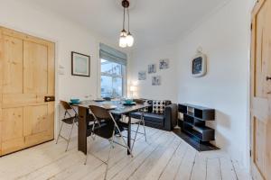 a dining room with a table and chairs at 3 Bed in Broadstairs oc-th006 in Broadstairs
