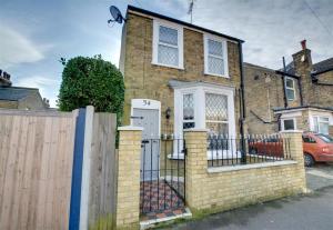 a brick house with a gate and a fence at 3 Bed in Broadstairs oc-th006 in Broadstairs