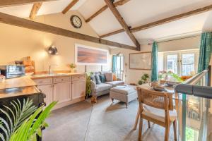 a kitchen and living room with a couch and a table at 1 Bed in Reeth oc-t29540 in Reeth