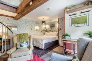 a bedroom with a bed and a desk and chairs at 1 Bed in Reeth oc-t29540 in Reeth