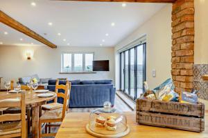 a living room with a table and a couch at 3 Bed in Outwell oc-b28260 in Upwell